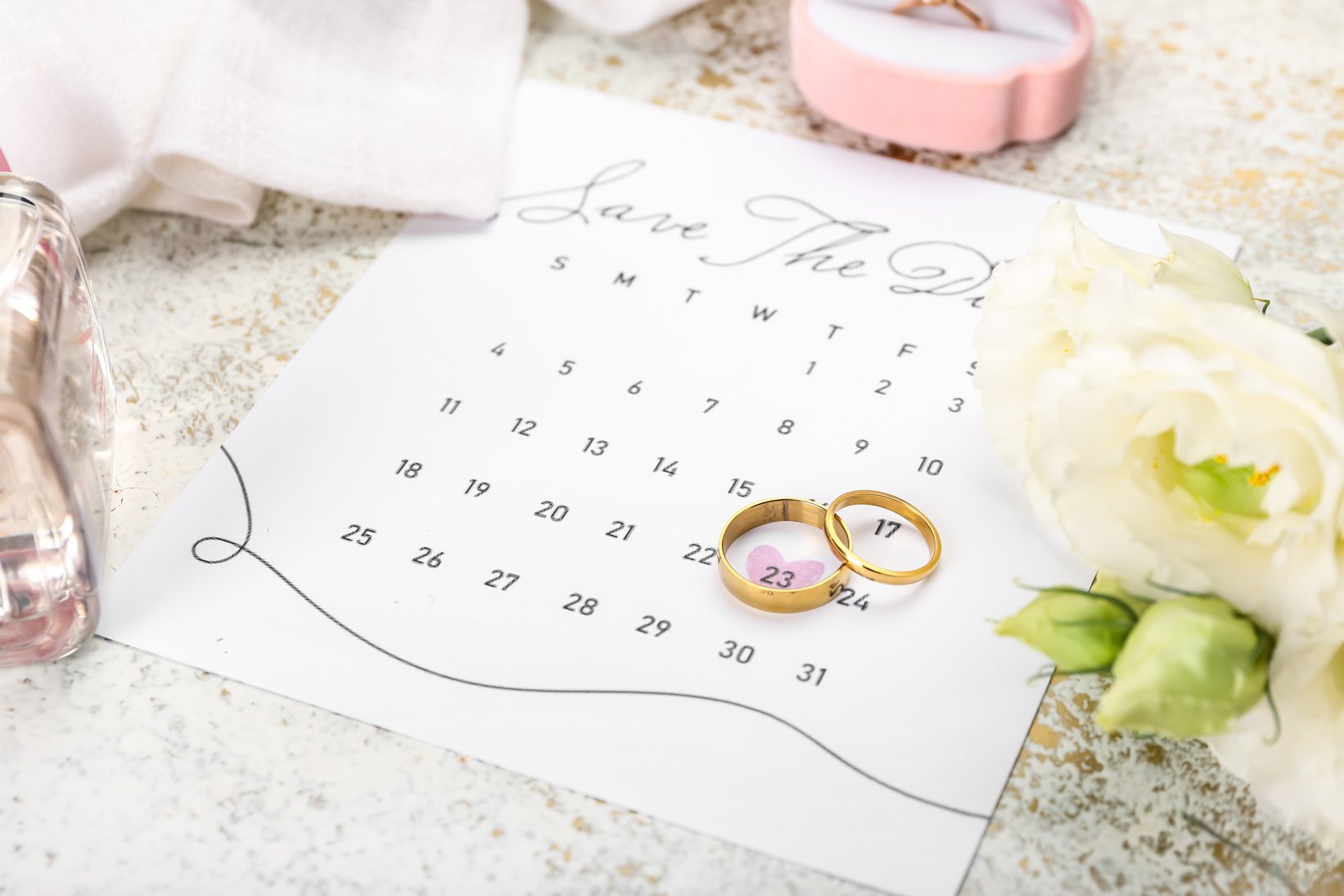 Beautiful Composition with Wedding Calendar on Table